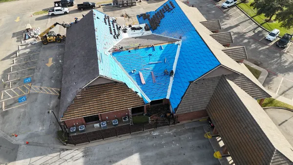 Professional commercial roofing services in DFW - aerial view of commercial building with expertly installed roofing system