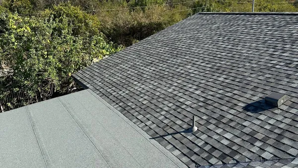 Professional roof maintenance services by Apex Premier Roofing - expert technician performing thorough roof inspection in DFW